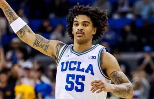 UCLA Men's Basketball player Skyy Clark with his hand in the air
